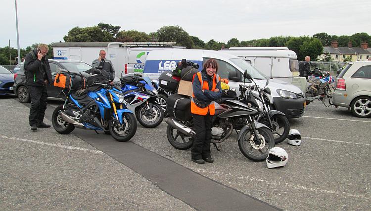 Sharon's face is screwed up with laughter at the queue for the ferry