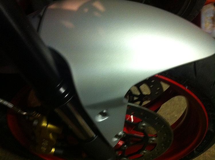 The finished mudguard back on the bike and looking like new