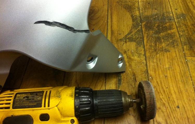 The mudguard with the v ground in it, next to the drill