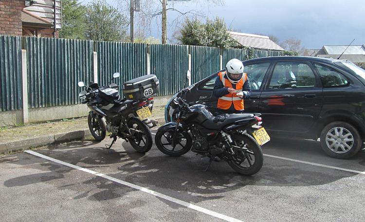 Sharon checks her mobile phone as we get ready to ride the bikes