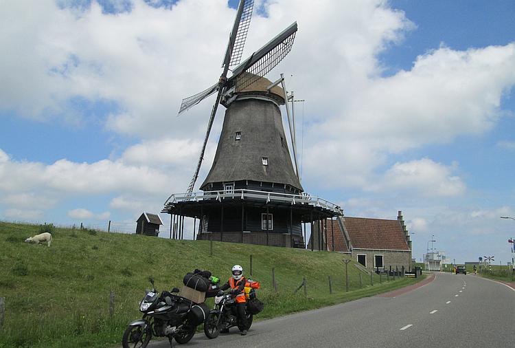 Our two motorcycles in from of a traditional wooden Dutch windmill