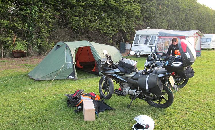 Sharon is loading her bike with all her gear at the anglian hotel campsite