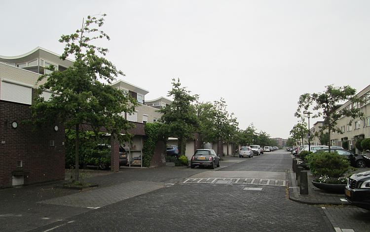 A regular suburban street north of The Hook of Holland filled with houses and apartments