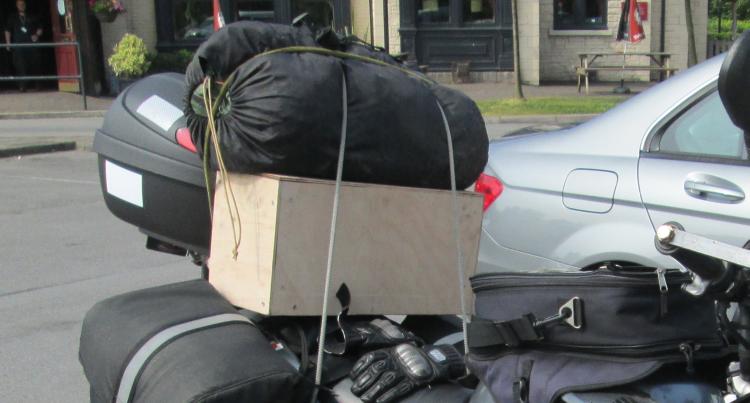 The wooden box that sits perfectly on the back seat of Ren's 125 motorcycle