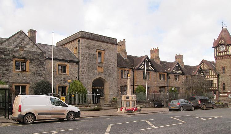 The main road in Ledbury, we see a long old stone built house