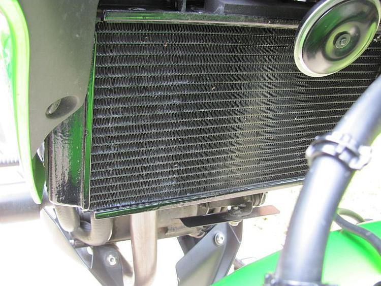 The radiator up close and you can see a piece of metal below it to deflect stones from the front wheel