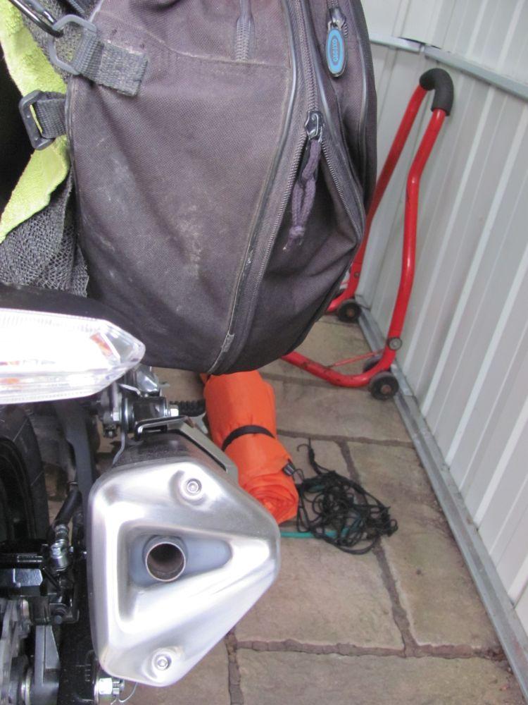 There's space between the pannier bag and the exhaust now