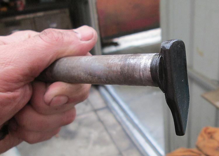 The pin with it's new bit of metal welded on and painted, ready to be fitted