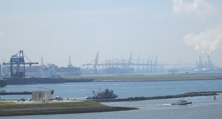 Cranes and industry set against the blue skies near Rotterdam