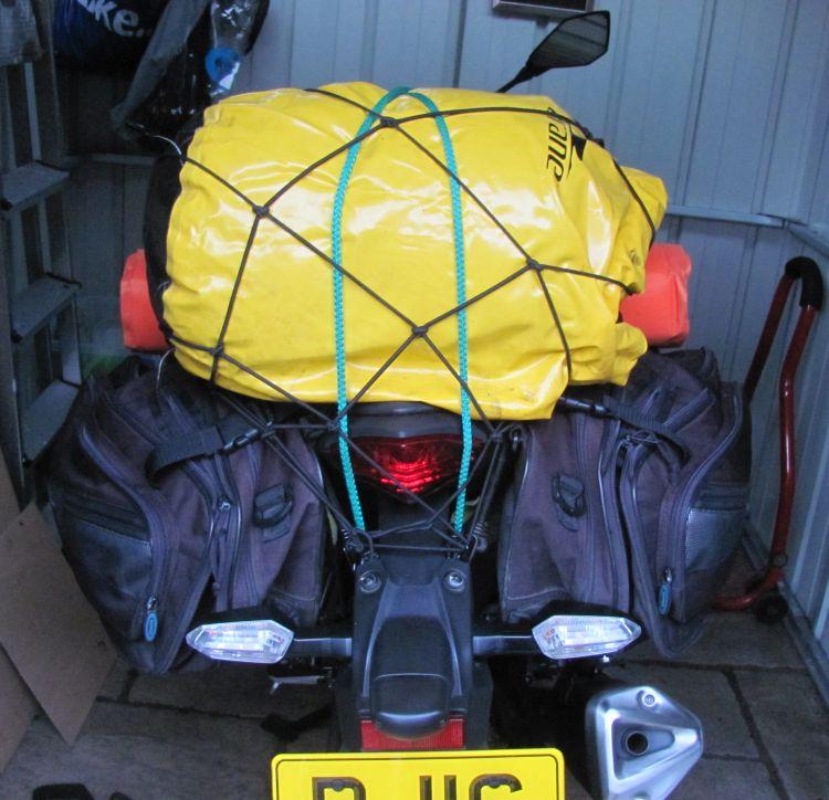 The bike now with the panniers and roll bag all strapped on