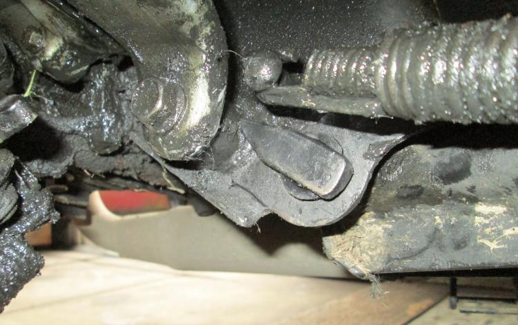 the reworked pin is in place and the metal piece is trapped between part of the frame