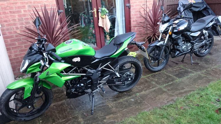 The Kawasaki Z250SL and the Keeway RKS125 both shiny clean at Sharon's place