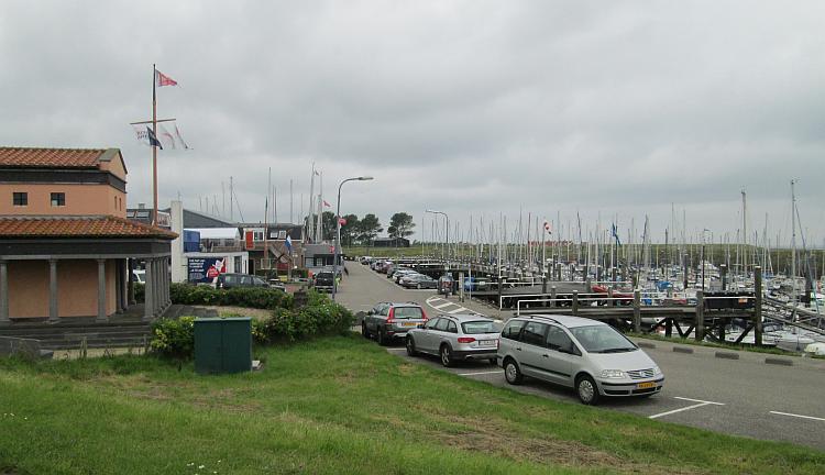 Colijnsplaat harbour filled with boats and a few buildings on the docks