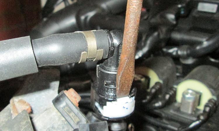 Use a screwdriver to pry the retaining clip off the connector