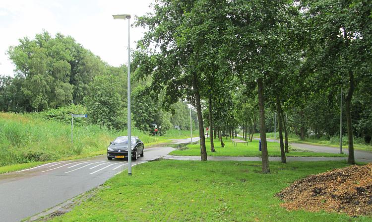 A patch of grass to park on surrounded by trees just off the motorways