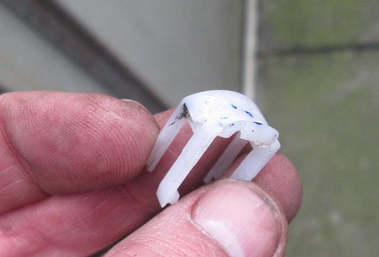 A white horseshoe shaped piece of plastic