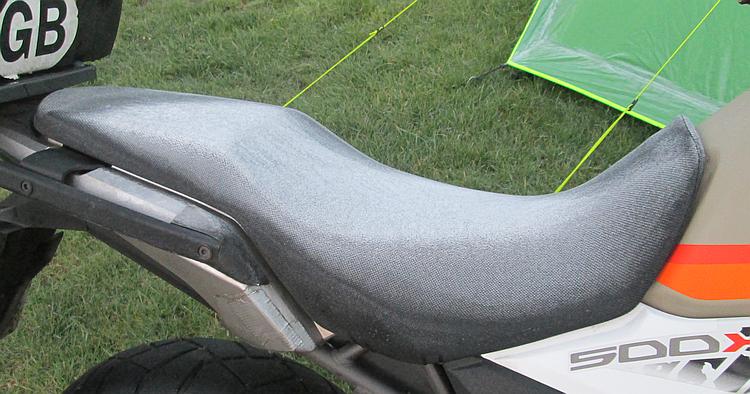 The seat of Ren's CB500X is covered in frost after the cold night at Usha Gap
