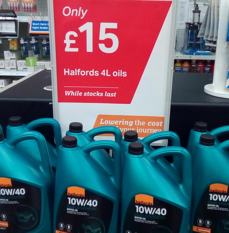 The stand showing a big sign for the oil at £15 per tub, and the tubs below