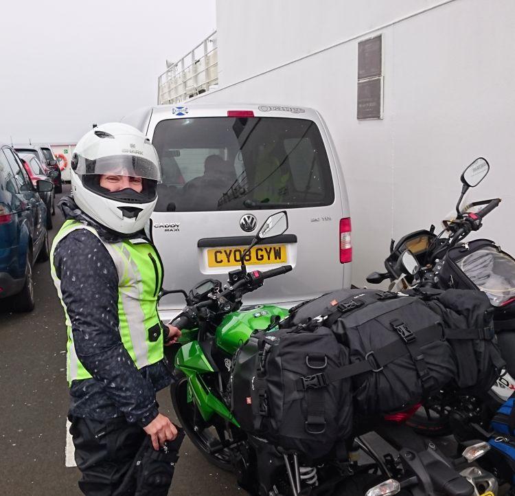 Sharon stands by her Kawasaki on the deck of the ferry across the Clyde to Durness