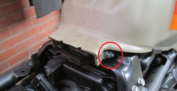 The bolt at the back of the tank where the tank has pivoted