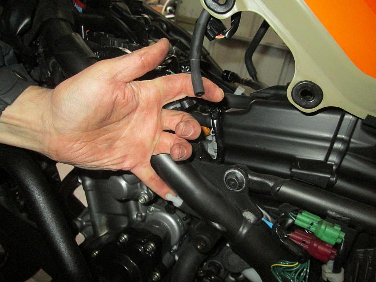 The pipe and it's connector, disconnected but shown by Ren's hand