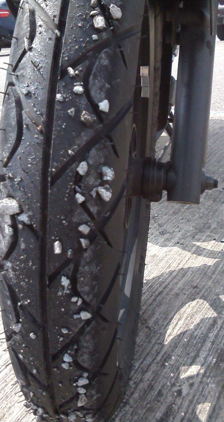 Sharon's tyre with sticky tarmec and stone chips all over it