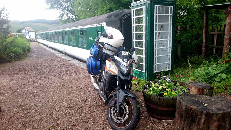 Ren's CB500X at Sleeperzzz with a carriage behind it where they will be sleeping