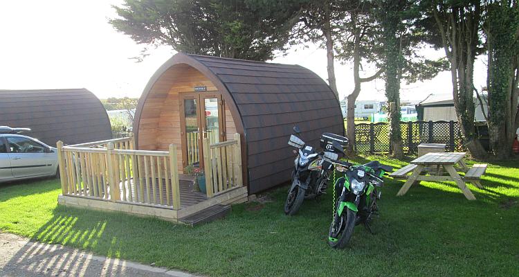 The camping pod and the bikes in the morning sun