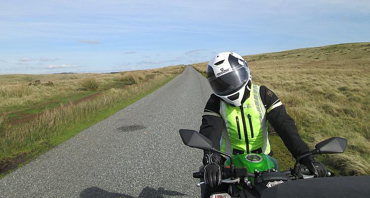 Sharon on her bike behind Ren's bike seen from Ren's point of view