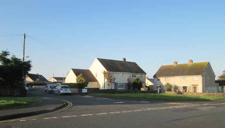 Ordinary white pained houses at St Davids set against clear blue skies
