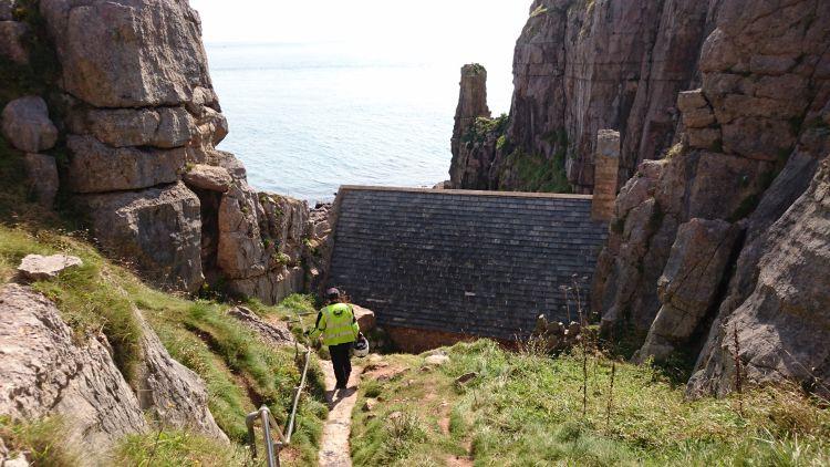 Ren is clinging to the rail as he makes his way down steep steps to the Chapel