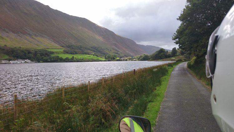 The lake and beyond a angular hill rises out from the valley floor, dominating the scene