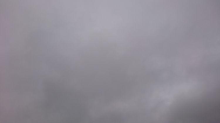 All we can see is grey clouds in the sky with no other details at all