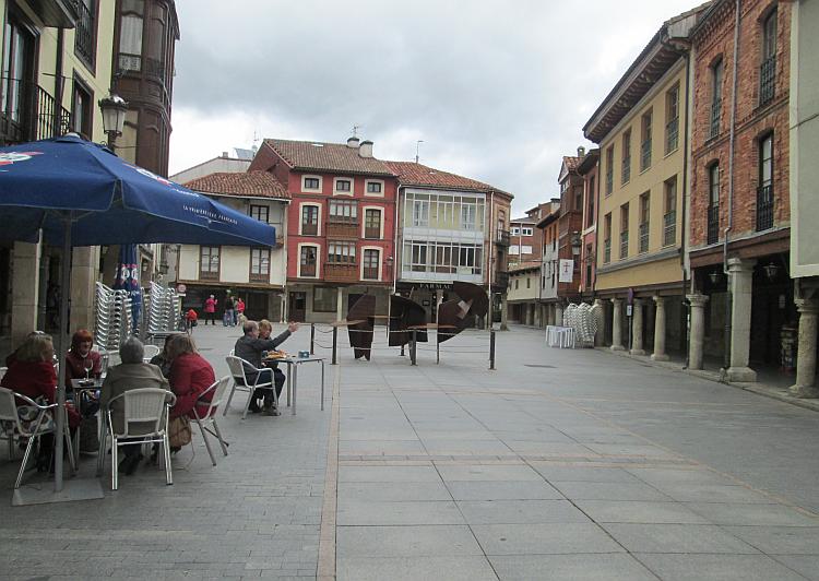 2 and 3 story building presumably quite old surround a small town square with the odd cafe