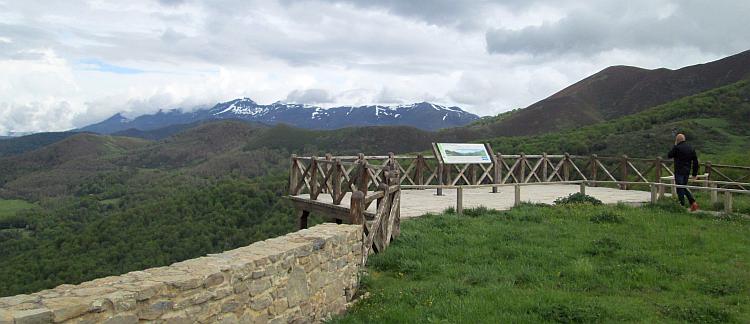 green hills and snow capped rock tipped mountains in the distance. Excellent Spanish scenery