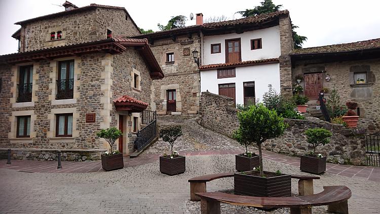 Modern houses sit with old while both look in balance and character to the rest of the town