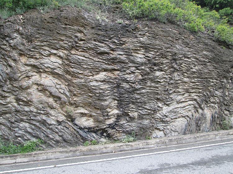 Complex, twisted and at all angles the strata of the rocks suggests great forces at play