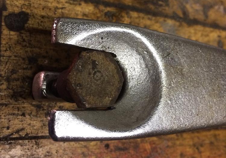 The ball join splitter has had the fork widened enough for the bolt head to pass through