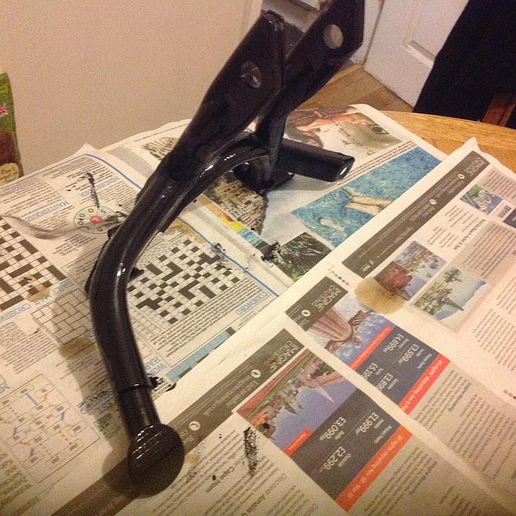 The centre stand has a thick coat of shiny black enamel paint