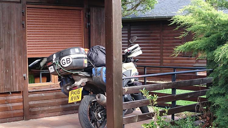 Ren's CB500X Honda on the veranda of the lodge