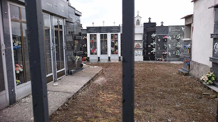 Glass and marble fronts to small building are in fact mausoleums