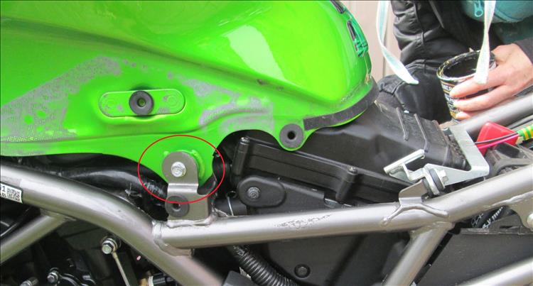 One of the two tank bolts that hold the tank in place