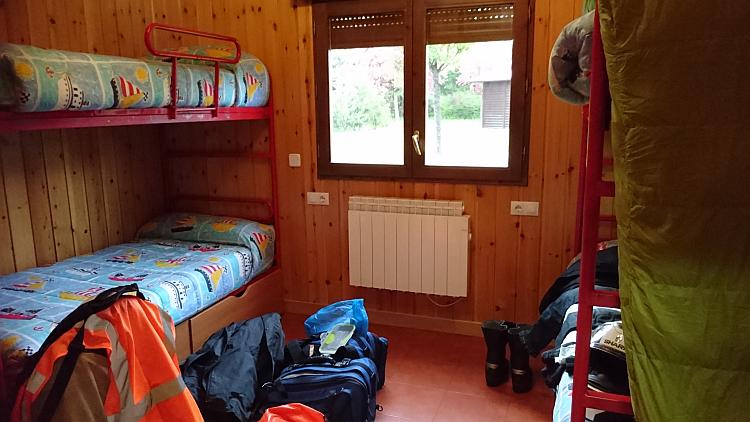 4 metal framed bunks in the second bedroom of the lodge