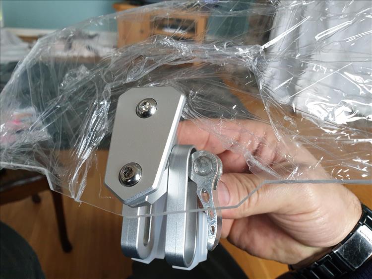 The screen deflector still with it's protective plastic sheeting in place