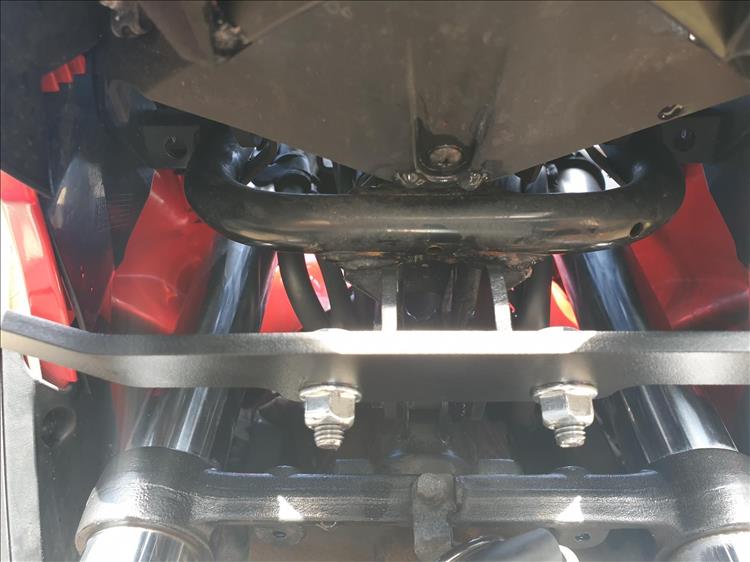 the bracket is bolted up behind the headlight, hidden deep in the fairing
