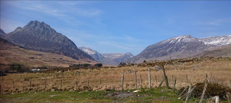 Tryfan's rocky mountain and other spectacular snow covered mountain tops in Snowdonia
