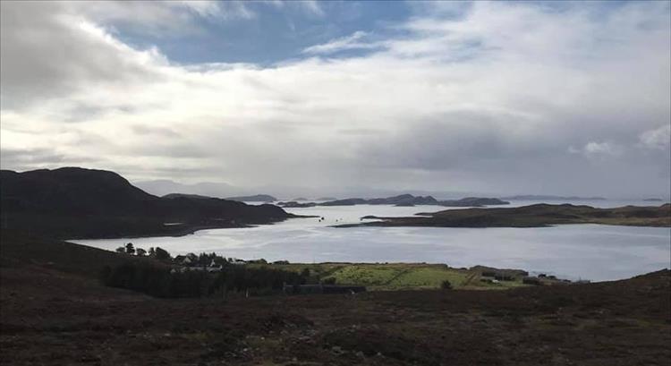 Promontories and islets under grey skies along the remote and rugged shore