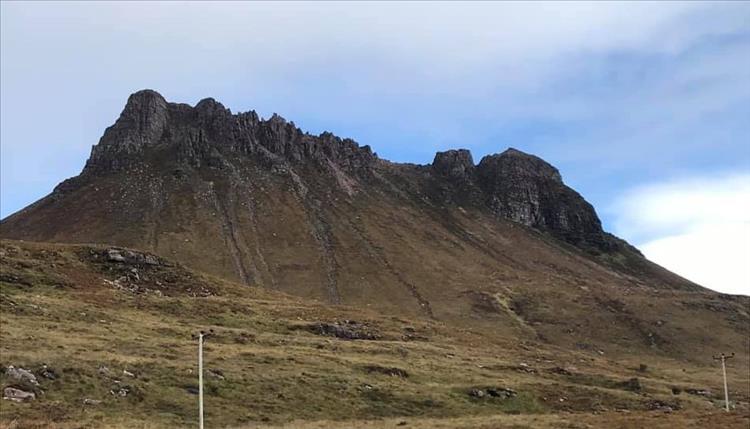 Big vast towering rocky mountain in the Scottish Highlands