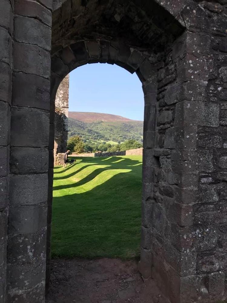Looking through an old doorway out to the ruins and the beautiful welsh countryside