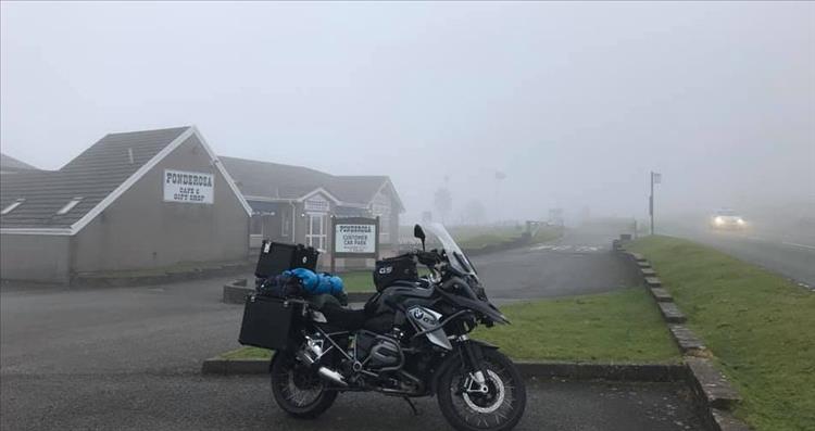 The building of The Ponderosa cafe on a misty hilltop